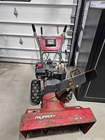 Front view showing overall snow blower, handles, control panel