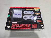 Front of retail box showing console and controllers imagery