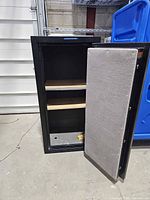 Safe exterior with door open showing shelves