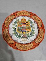 Front of plate showing crest, border design and overall condition