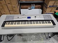 Front view of Yamaha YPG-525 keyboard showing full keybed, speakers and control panel