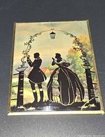 Full view of framed silhouette painting front