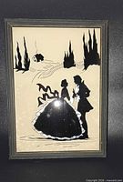 Full view of reverse glass silhouette painting in frame