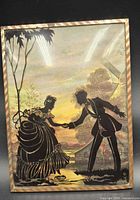 Front view of reverse painted silhouette plaque showing couple scene