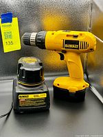 Drill, battery and charger together