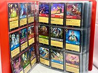 open binder showing multiple pages of Disney Lorcana cards including Mickey Mouse, Stitch and foil cards