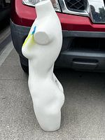 Left side profile of white female torso mannequin