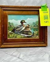 Full view of framed duck print in wood frame
