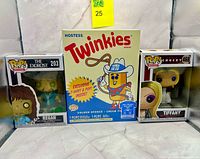 Front view of all three boxed Funko items
