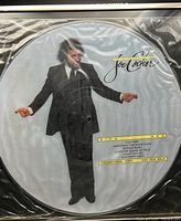 Front view of picture disc showing full artwork and promo text