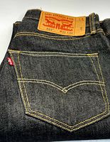 Rear view showing pocket, red tab, leather patch, contrast stitching