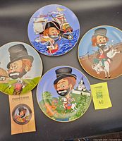 Four Freddie Clown plates and pamphlet overview