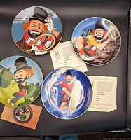 All four Freddie Sports plates with COAs visible