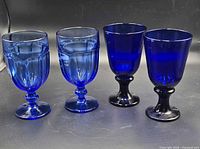 All four cobalt blue goblets: two Gibraltar, two Flare