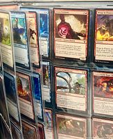 Close view of sleeve page with Theros Beyond Death red cards (Arena Trickster, Wrap in Flames, Aspect of Manticore, Underworld Rage-Hound)