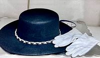 Hat and gloves side view on shelf