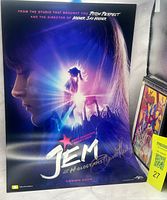 Full poster front showing artwork, autograph, adjacent DVD for scale