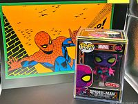 Art print and Funko Pop displayed together for size and set overview