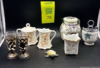 Group shot showing all eight items in lot
