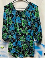 Front view of blouse on hanger