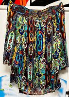 Full view of blouse hanging, showing overall style, print, and condition