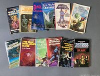 All twelve paperback books laid out in two rows, covers visible