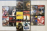 All 14 PlayStation 2 game cases laid out front cover visible