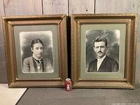Both framed portraits side by side with soda can for scale