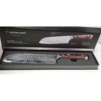 Boxed 7" Santoku knife shown with patterned blade and red Pakka wood handle