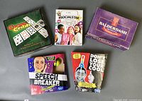 Top view of five boxed games laid out