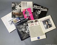Nine photography books and magazines laid out showing titles