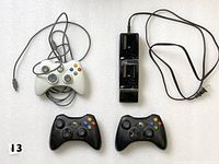 White wired controller, dual charging dock, two black wireless controllers