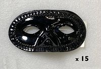 Front view of one shiny black masquerade mask, shows embossed border and shape