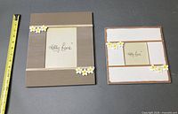 Front view of both Kelly Lane frames with measuring tape showing sizes