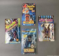 Group shot of all four sealed action figures