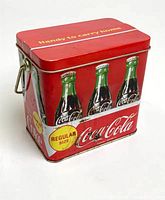 Front and side view of Coca-Cola tin showing bottle graphics
