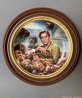 Front view of plate showing artwork of Captain Kirk with Tribbles in wood frame