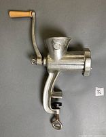 Full side view showing hand crank, body and clamp