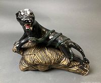 Front view of ceramic panther and snake lamp showing figures and base