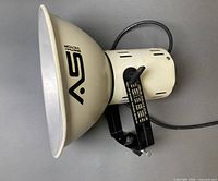 Side view of Smith Victor light showing reflector, bracket, cord