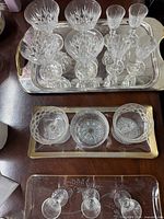 Closer view of cut-crystal glasses on central tray