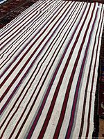 Full view of striped kilim rug