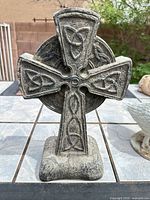Front view of Celtic cross resin statue showing design details and finish