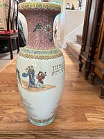 Full view of vase showing neck, body and painted figures