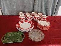 Group view of all dinnerware pieces: plates, mugs, tray, charger