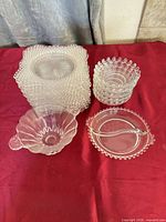 Group shot of stacked square plates, stacked hobnail bowls, compote bowl, divided relish dish