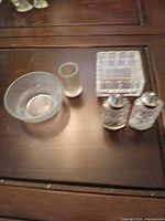 All five pressed glass pieces displayed on table