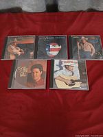Group shot of all five country music CDs in jewel cases