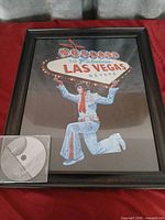 Full view of framed print with CD for scale