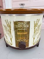 Front view of vintage Hamilton Beach Crock Watcher showing wheat pattern and control dial